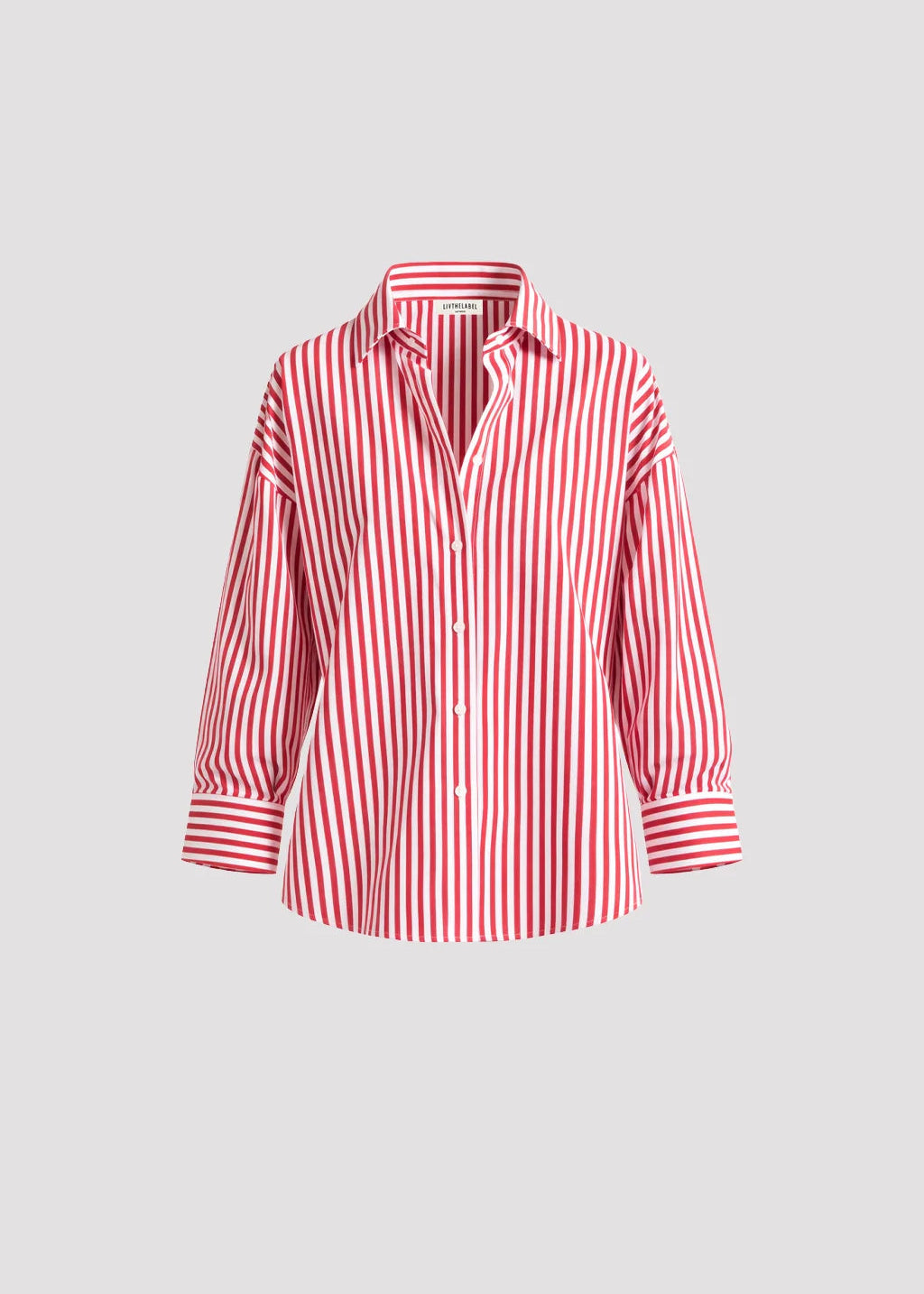 Relaxed cotton shirt with vertical stripes and open back detail. Sharp yet effortless.
