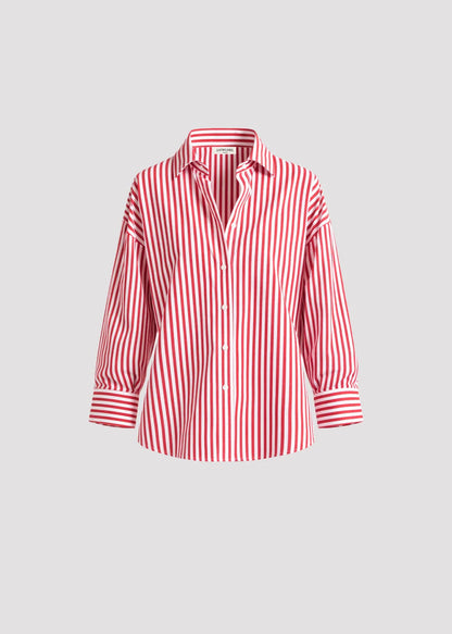 Relaxed cotton shirt with vertical stripes and open back detail. Sharp yet effortless.