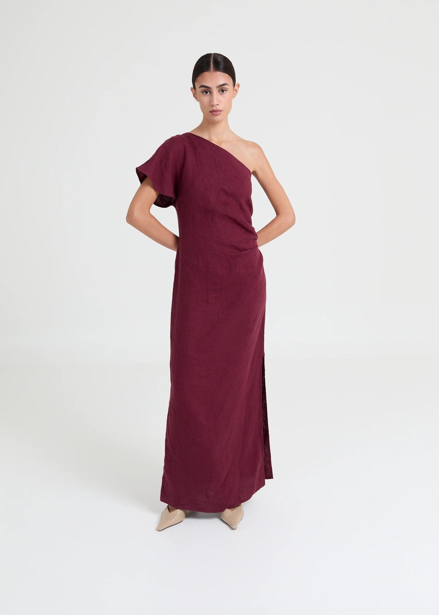 Asymmetric one-shoulder dress crafted in lightweight linen. Defined by soft structure, elegant drape, and a modern, elongated silhouette.


