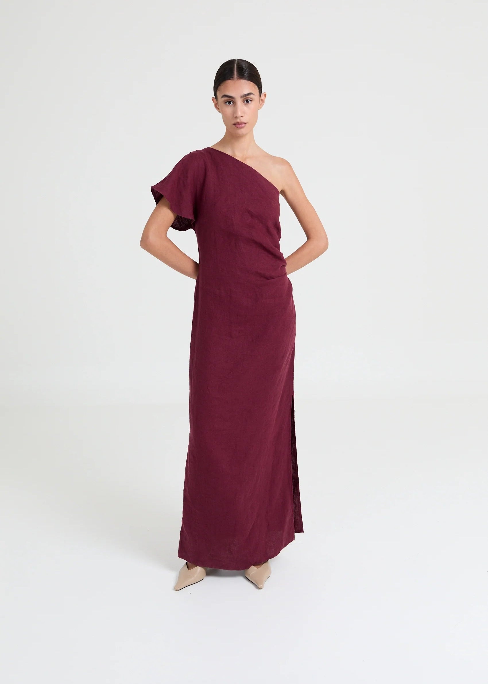 Asymmetric one-shoulder dress crafted in lightweight linen. Defined by soft structure, elegant drape, and a modern, elongated silhouette.

