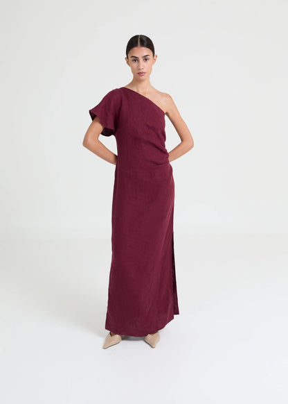 Asymmetric one-shoulder dress crafted in lightweight linen. Defined by soft structure, elegant drape, and a modern, elongated silhouette.

