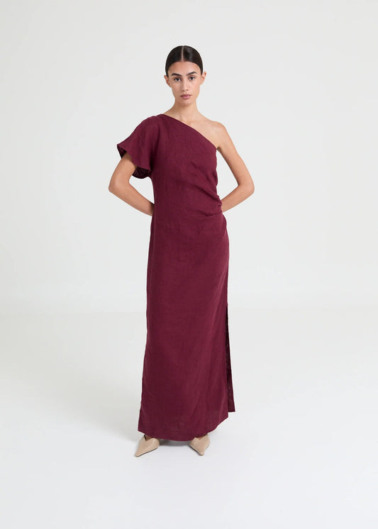 Asymmetric one-shoulder dress crafted in lightweight linen. Defined by soft structure, elegant drape, and a modern, elongated silhouette.


