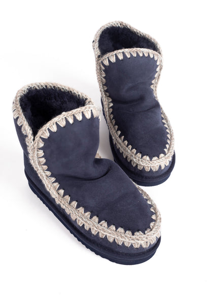 MOU -&nbsp;This style has been expertly hand-crafted in divinely warm double-face sheepskin, with mou trademark hand-crochet wool stitching, a supportive heel counter and EVA &amp; rubber outdoor sole. Incredibly comfortable and hard-wearing. Height 18cm. Regular fit.